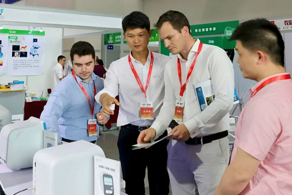 iSperm Medical professionals discussing veterinary semen analyzer and animal breeding solutions